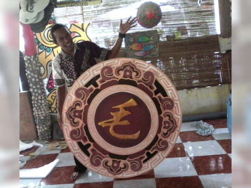 Berkah Imlek,  Seniman Ini Kerjakan Logo Keluarga Tionghoa